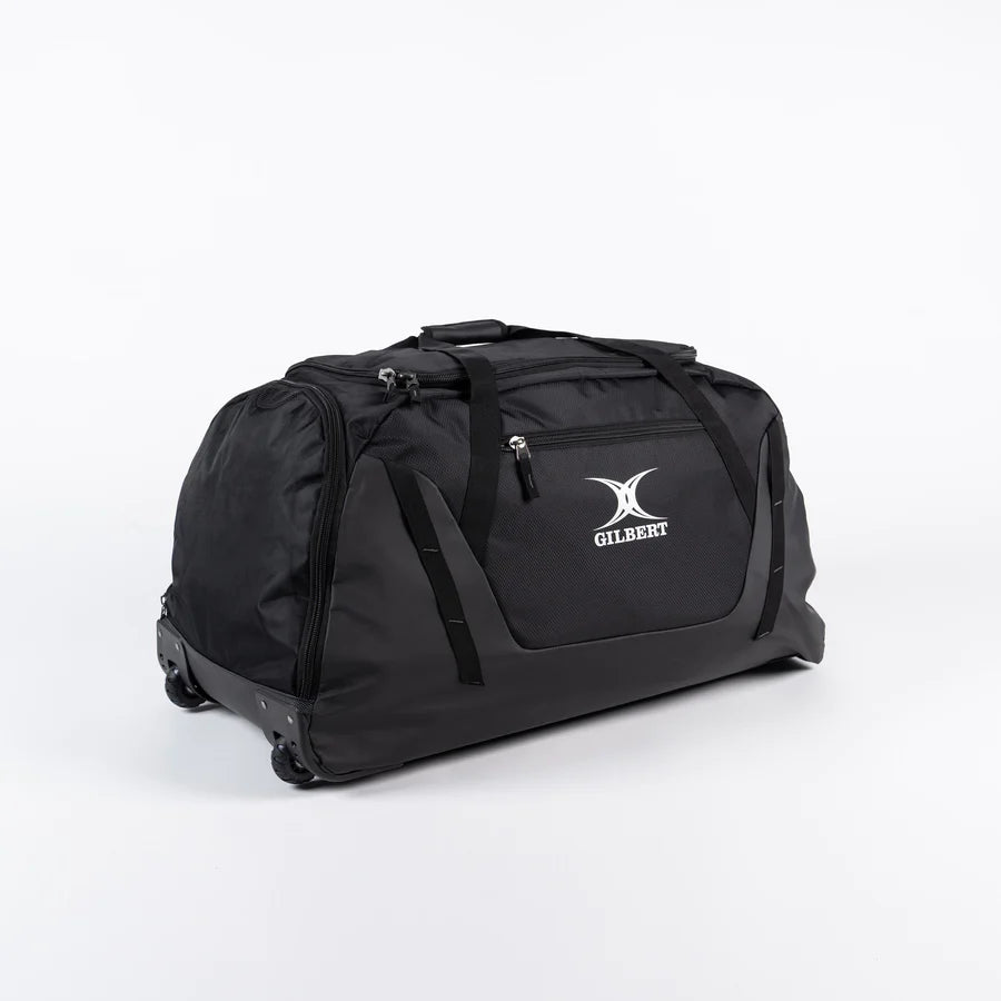 A spacious black Gilbert Club V4 Team Bag with wheels and handles, featuring the Gilbert logo on the side, displayed against a plain white background.