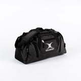 The Gilbert Club Players V4 Holdall by Gilbert is a durable black/black sports bag with multiple zippers, carrying handles, adjustable shoulder strap, and a front pocket featuring the Gilbert logo—perfect for rugby players.