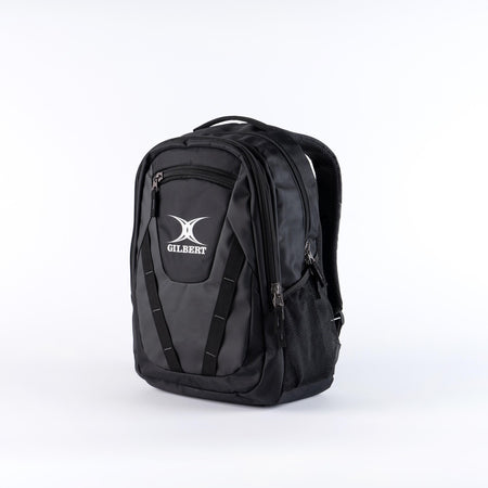 The black/black Gilbert Club V4 Rucksack features multiple zippered compartments, a mesh side pocket, and a white Gilbert logo on the front, shown against a plain white background.