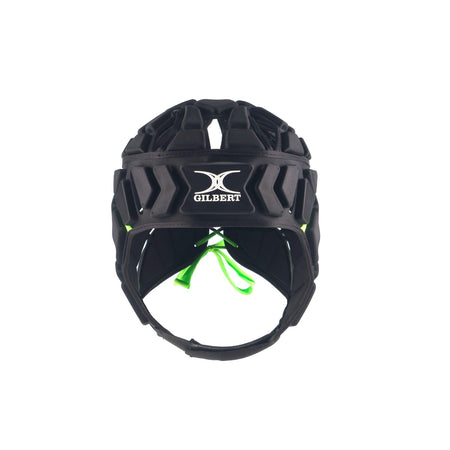 Front view of the black Gilbert Fusion Senior Headguard with shock-absorbing padding, ventilation holes, chin strap, and green inner accents. The Gilbert logo appears on the forehead.