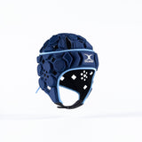 The Gilbert Octane Senior Headguard in Navy/Sky features hexagonal and diamond-shaped padding, light blue trim, an expandable lace closure, and the Gilbert logo on the front, displayed against a white background.