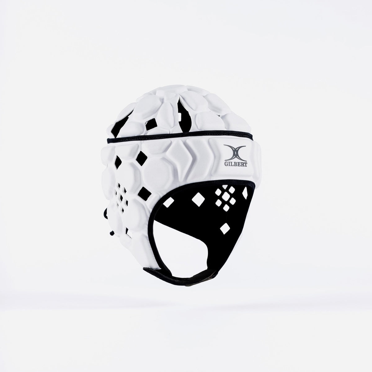 The Gilbert Octane Senior Headguard by Gilbert, in White/Black, features black inner padding, diamond-shaped vents, an expandable lace closure, and the Gilbert logo on front. It is displayed against a plain white background.