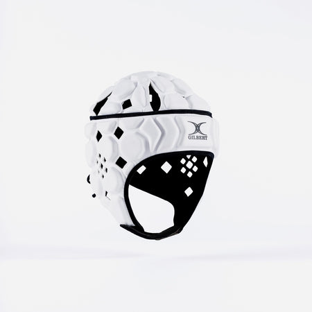 The Gilbert Octane Junior Headguard in White/Black, featuring diamond-shaped cutouts, a front Gilbert logo, and an expandable lace closure, is shown against a plain white background.