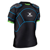 The Gilbert XP500 Body Armour is a black short-sleeve rugby shirt with impact protection padding, blue stitching, gray padded shoulders and chest, green cuffs, and the Gilbert logo on front—ideal for intense matches.