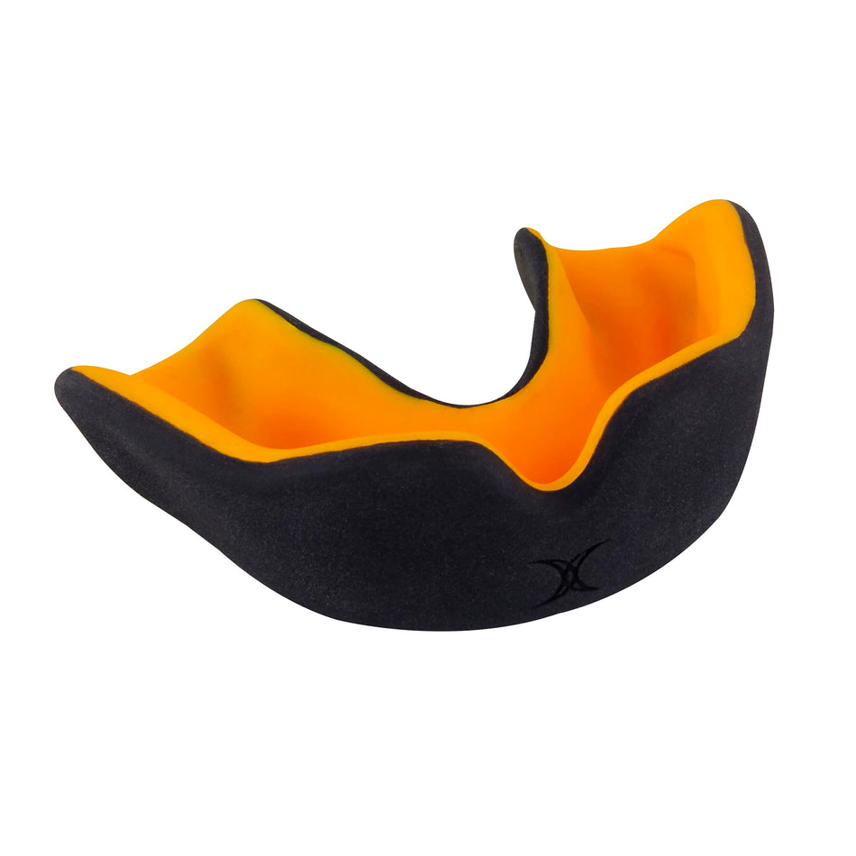 The Gilbert XBrace Dual Density Mouthguard by Gilbert in black/orange offers sports protection with a contoured shape for upper teeth.