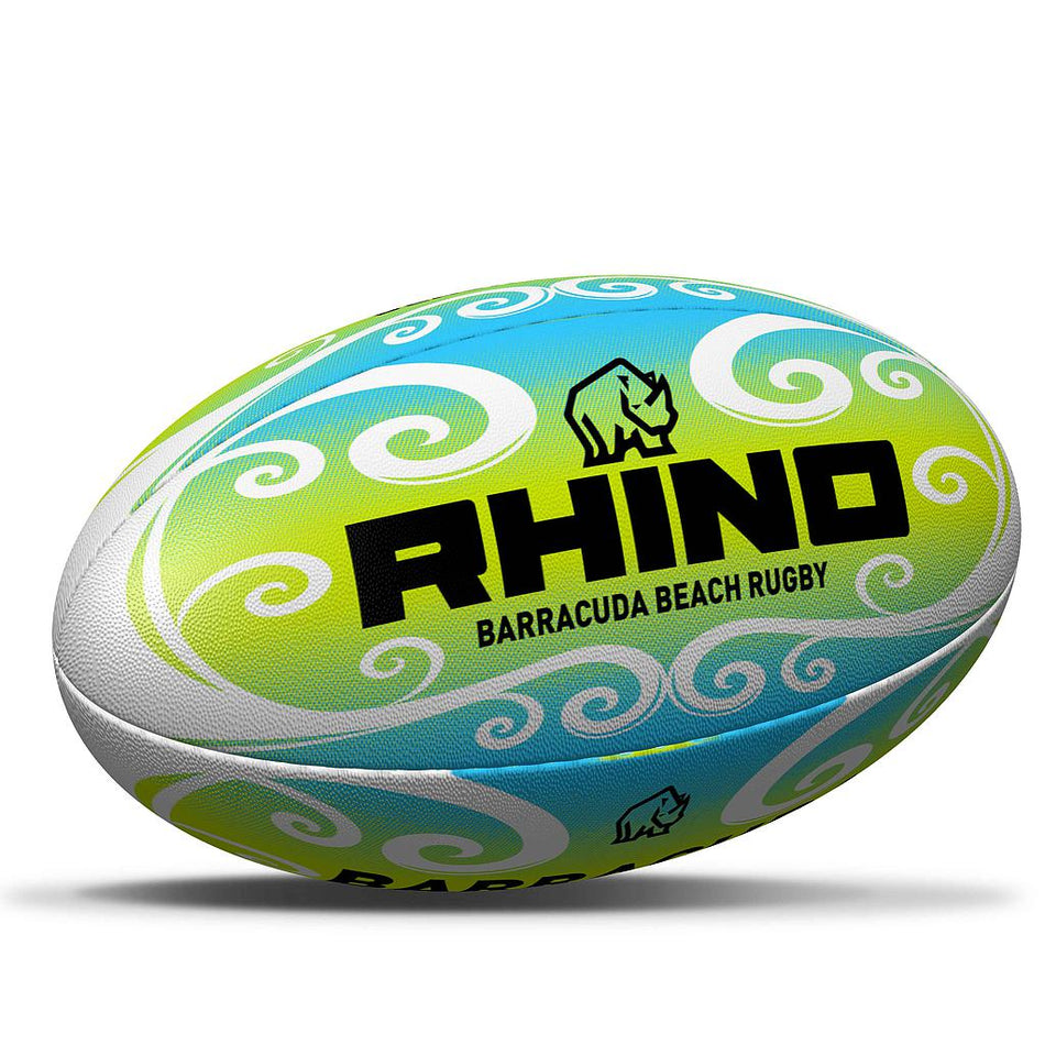 The Rhino Barracuda Beach Pro Rugby Ball by Rhino features lightweight blue, green, and white swirling patterns, the RHINO Barracuda Beach Rugby text with a rhino logo, and is made from durable Carbonium PVC.