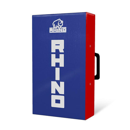 The Rhino Mini Hit Shield 50x30x10cm by Rhino is a blue and red rectangular shield featuring a white RHINO logo and rhino emblem, with a black side handle—perfect for rugby training.