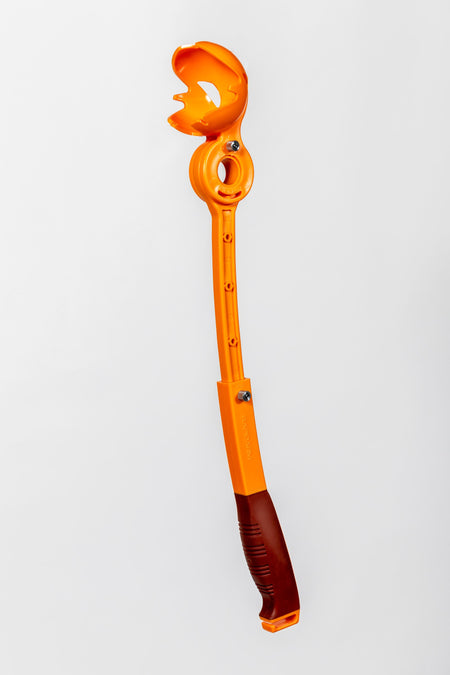 The RapidArm+ Ball Thrower by RapidArm, featuring an orange plastic body, brown handle, and adjustable arm for dog ball throwing, is shown against a plain white background.