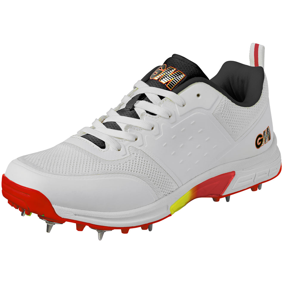 The Gunn & Moore Rival Cricket Spikes are high-performance white shoes with steel spikes, a black tongue and inner lining, red and yellow sole accents, and GN branding on the side.