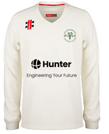 The Gray Nicolls Rockhampton CC Pro Performance Sweater - Junior is a white long-sleeve cricket sweater with the club logo, black "Hunter" sponsor, “Engineering Your Future” text, and two red/black patches near the shoulders.