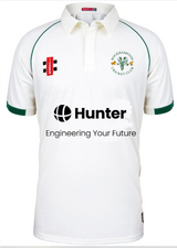 The Rockhampton CC Matrix V2 Playing Shirt - Junior by Gray Nicolls is a white shirt with green trim, displaying the club logo, the Hunter logo with "Engineering Your Future" tagline, and other sponsor logos on chest and sleeve.