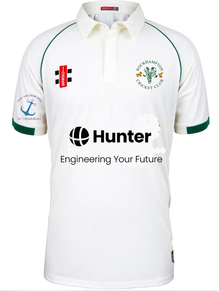 The Gray Nicolls Rockhampton CC Matrix V2 Playing Shirt – Senior is a white cricket shirt with green trim, moisture control, the club logo on the chest, sponsor logos including Hunter: Engineering Your Future, and an anchor sleeve logo.