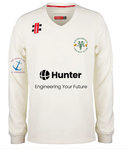 The Gray Nicolls Rockhampton CC Pro Performance Sweater - Senior features a cream color, club logo on the left chest, Hunter sponsor on the front, and “The Anchor Inn at Thornbury” on the right sleeve—perfect for dedicated cricket fans.