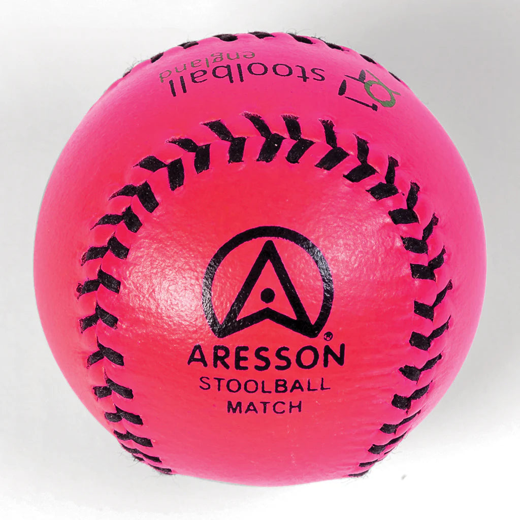 The Aresson Match Stoolball Ball in pink, featuring black stitching and a printed logo, is perfect for Stoolball England matches; pictured here against a white background.