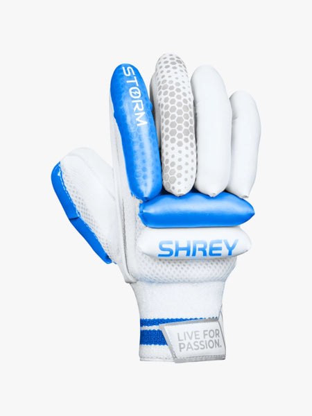The Shrey Storm Cricket Set (Kashmir Willow) includes white and blue batting gloves with padded, dot-detailed fingers labeled STORM and SHREY, plus a LIVE FOR PASSION wrist strap—ideal for your cricket gear.