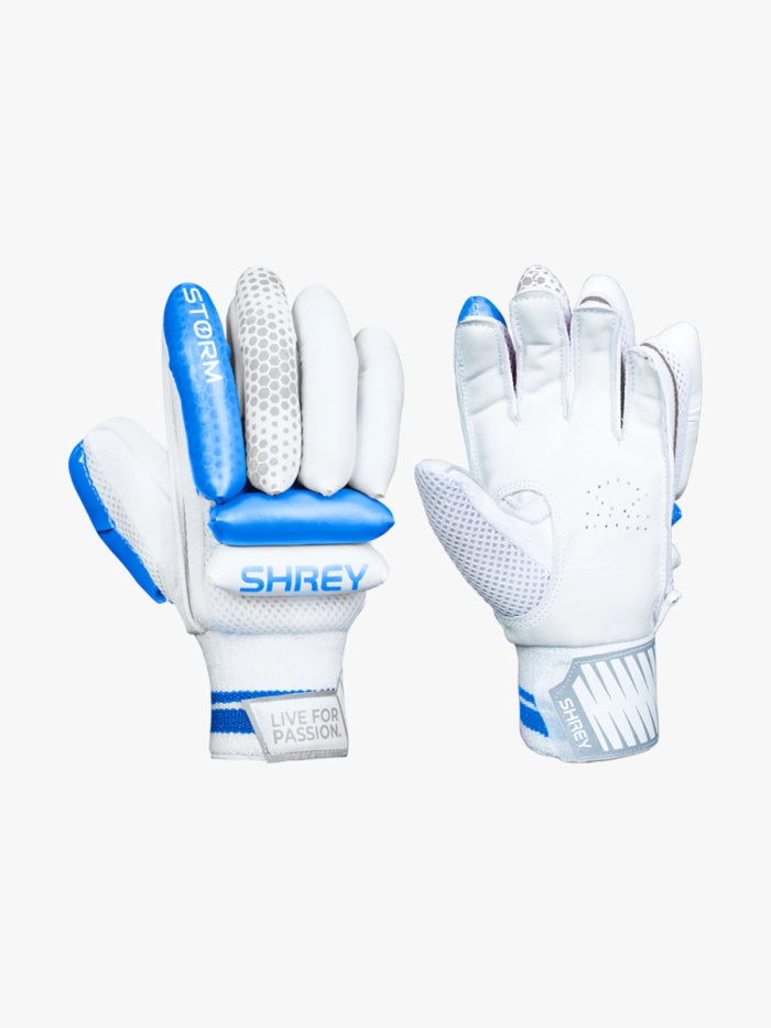 The Shrey Storm Cricket Set (Kashmir Willow) includes white and blue batting gloves with textured grip and “SHREY” plus “LIVE FOR PASSION” on the wrist straps, alongside a Kashmir Willow bat—ideal for any complete cricket kit.