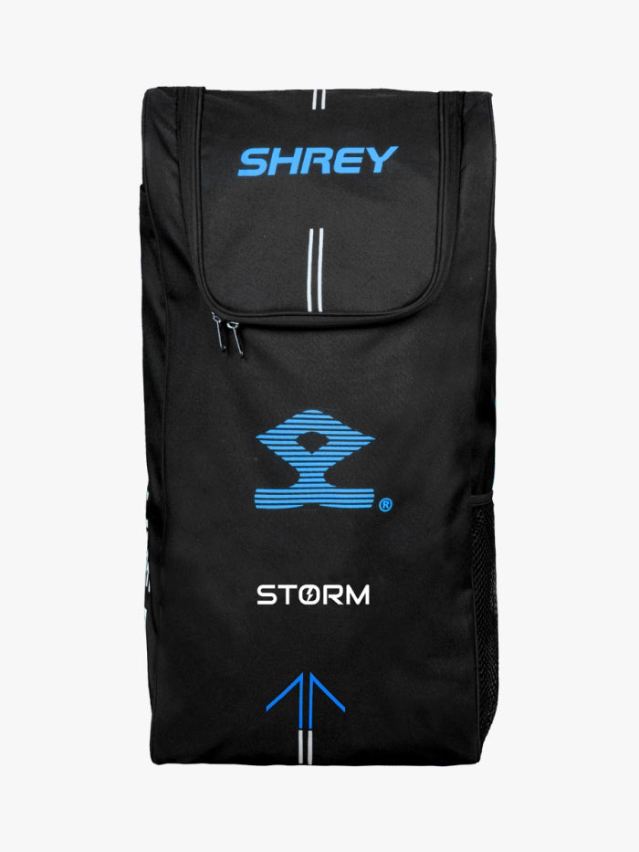 The Shrey Storm Cricket Set (Kashmir Willow) comes in a stylish black Shrey duffle bag with blue and white logos, zippered top flap, side mesh pocket, and vertical stripe accents—ideal for carrying your cricket gear.