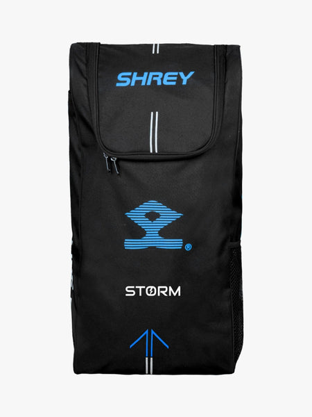 The Shrey Storm Cricket Set (Kashmir Willow) comes in a stylish black Shrey duffle bag with blue and white logos, zippered top flap, side mesh pocket, and vertical stripe accents—ideal for carrying your cricket gear.