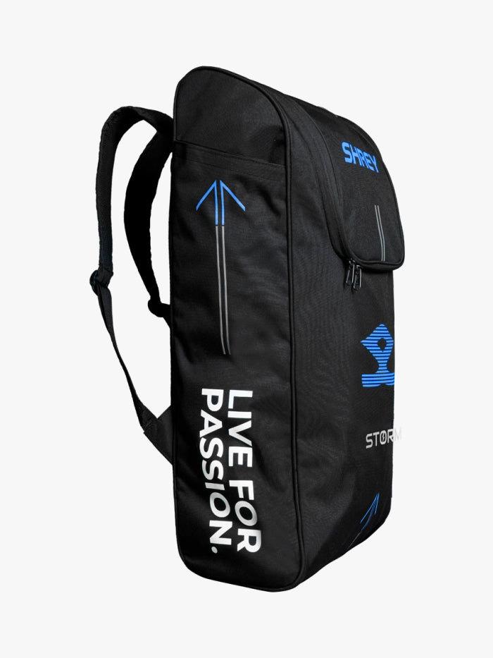 The Black Shrey Storm Duffle Bag with blue accents and "LIVE FOR PASSION" in white is ideal for carrying your Shrey Storm Cricket Set (Kashmir Willow), featuring a zippered front and adjustable shoulder straps.