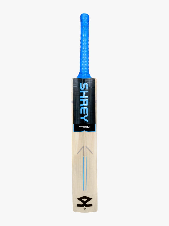 The Shrey Storm Cricket Set features a Kashmir Willow bat with a blue handle and black label showing the SHREY brand and STORM model, photographed on a plain white background.