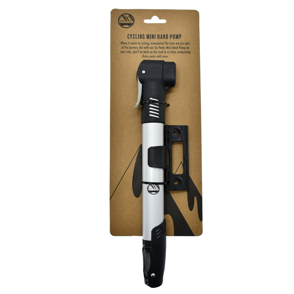 The Six Peaks Cycling Mini Hand Pump by Six Peaks, in silver and black, is attached to brown cardboard packaging that includes a wall mount and product details at the top.