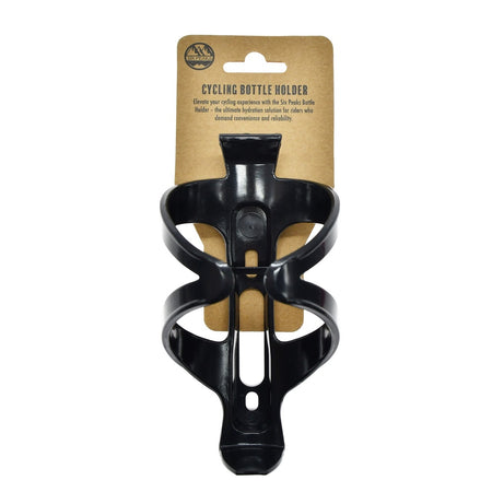 A black Six Peaks Cycling Bottle Holder is mounted on brown cardboard labeled SIX PEAKS CYCLING BOTTLE HOLDER, with branding and a description at the top—an essential accessory for every cyclist.