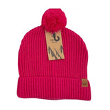 The Six Peaks Pom Beanie is a hot pink winter hat with a pom-pom, folded brim, and two brown tags—one on the cuff and one on top—showcasing mountain graphics and the Six Peaks fishhook logo.