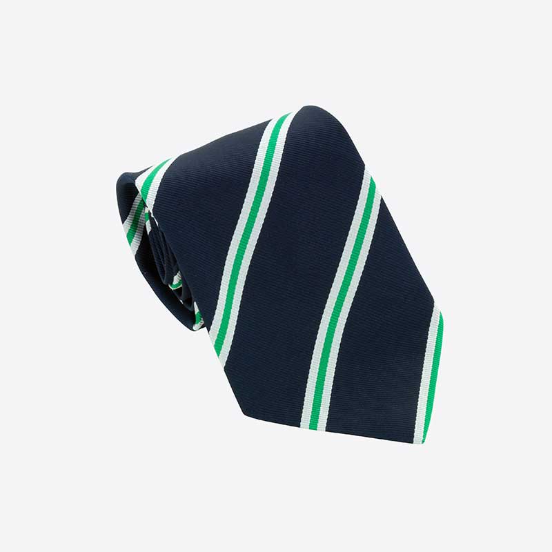 The Custom Club & School Tie by Martin Berrill Sports features navy blue fabric with diagonal white and green stripes, displayed neatly rolled on a plain white background.