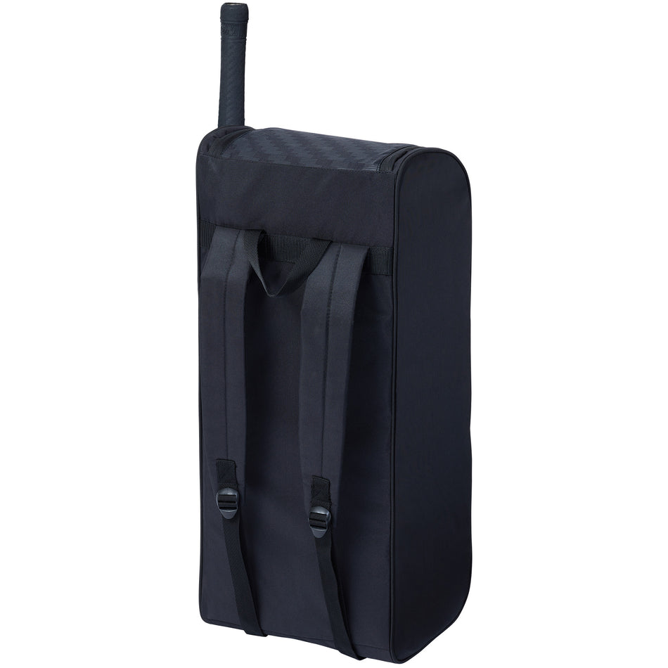 The Gunn & Moore Select Duffle 2026, a black cricket bag with shoulder straps, stands upright holding a tennis racket—ideal as a lightweight everyday cricket bag from Gunn & Moore.