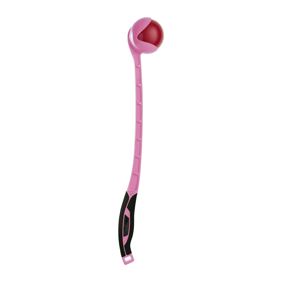 The Sidearm Pro Cricket Ball Thrower by Sidearm is a pink plastic training tool with a black grip handle, designed to hold a red ball in its curved end—ideal for cricket practice sessions.