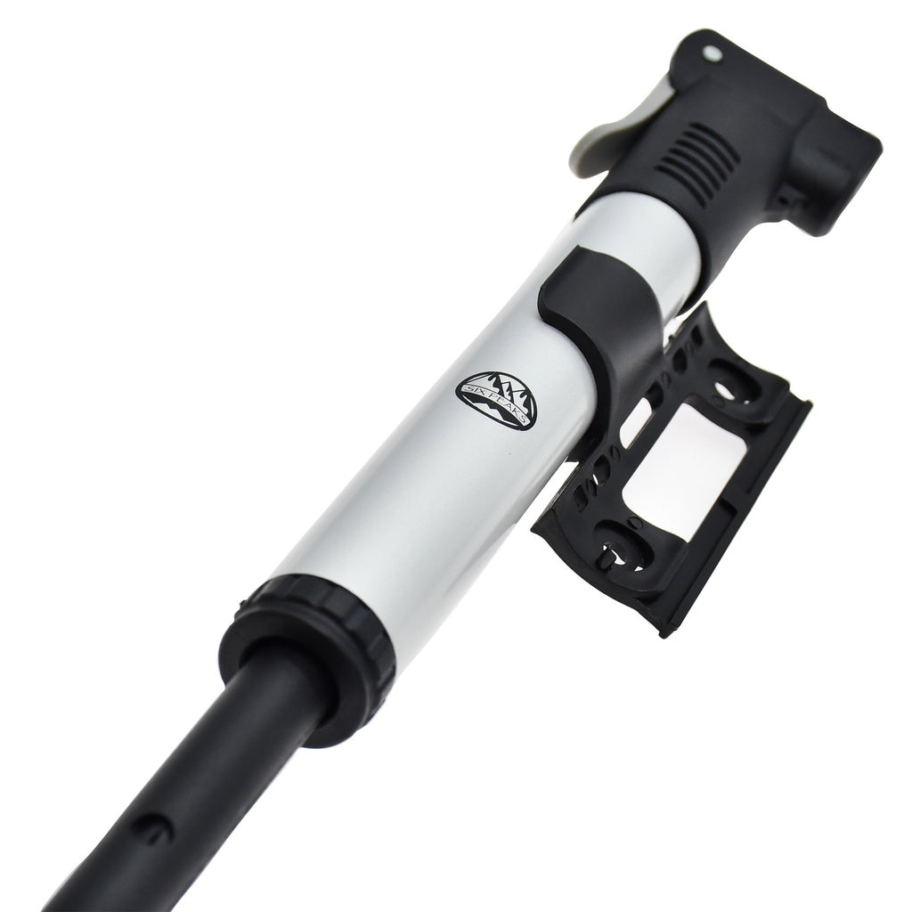 The Six Peaks Cycling Mini Hand Pump by Six Peaks is a compact silver and black bike pump with a mounting bracket, shown against a white background.