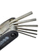 A close-up of the Six Peaks Cycling Multi Repair Tool by Six Peaks, a foldable hex key set with various millimeter-sized keys extended—an essential tool for bicycle maintenance.