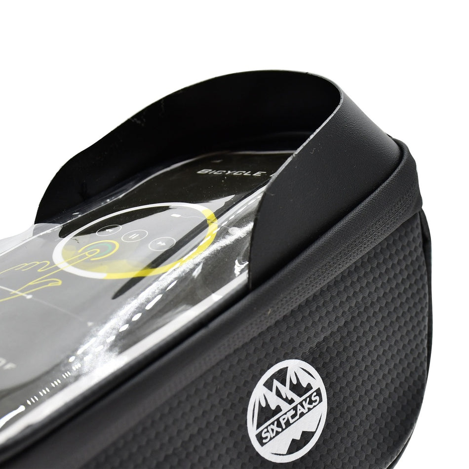 Close-up of the Six Peaks Cycling Phone Holder in black, featuring a textured finish, transparent top pocket displaying a smartphone, and the white Six Peaks logo on the side.