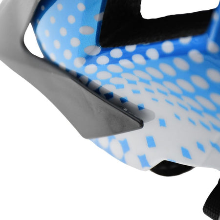 Close-up of the Six Peaks Junior Cycling Helmet by Six Peaks, featuring blue and white colors with dotted patterns and a gray plastic component.