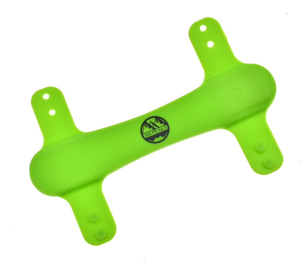 The Six Peaks LED Dog Collar Light is a bright green, bone-shaped plastic accessory with four flat ends (each with two holes) and a black mountains logo—ideal for high visibility on your pet’s collar.