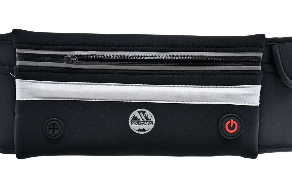 Close-up of the Six Peaks LED Dog Lead Running Belt—features a black waist pouch with zippered pocket, reflective stripe, LED night light, two buttons (including a red power button), and Six Peaks logo. Ideal for hands-free dog walks or runs.