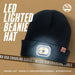 The Six Peaks LED Lighted Beanie Hat by Six Peaks is shown on a tan background, featuring a rechargeable headlamp, included micro USB charging cable, long-lasting battery, and one-size-fits-most fit.