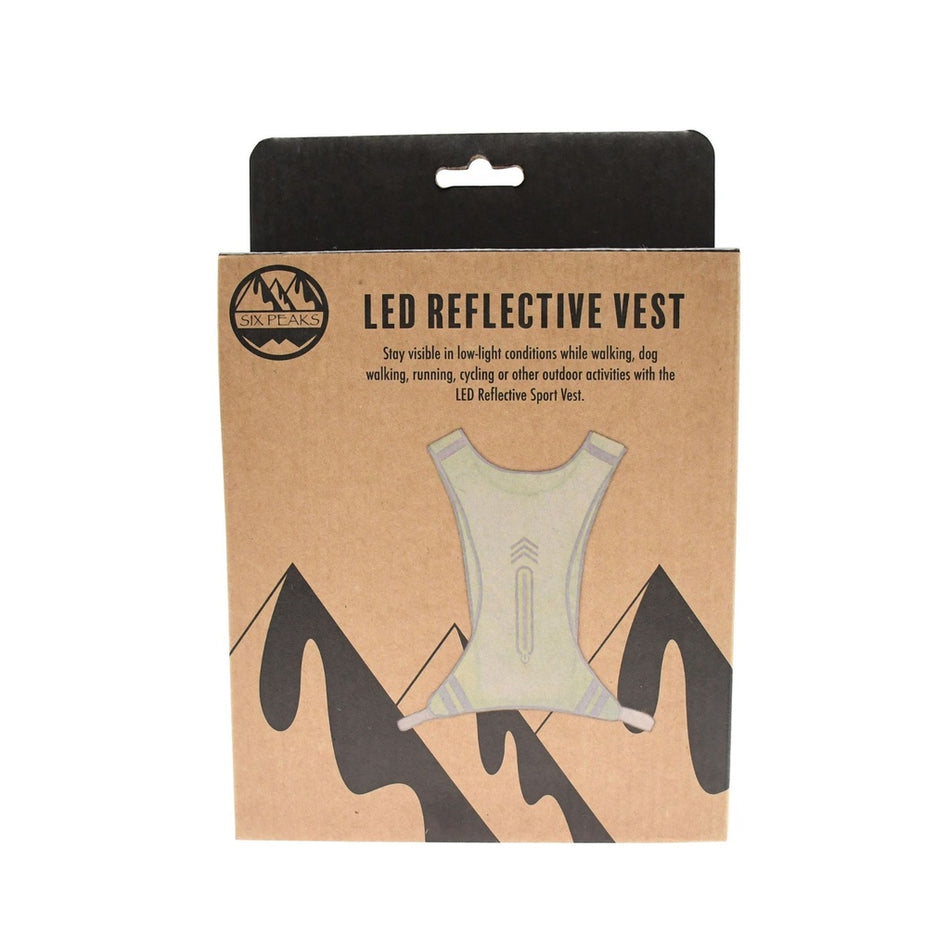 Brown packaging for the Six Peaks LED Reflective Sport Vest features vest and mountain illustrations; text emphasizes enhanced visibility and safety by Six Peaks for outdoor activities such as walking, running, and cycling.