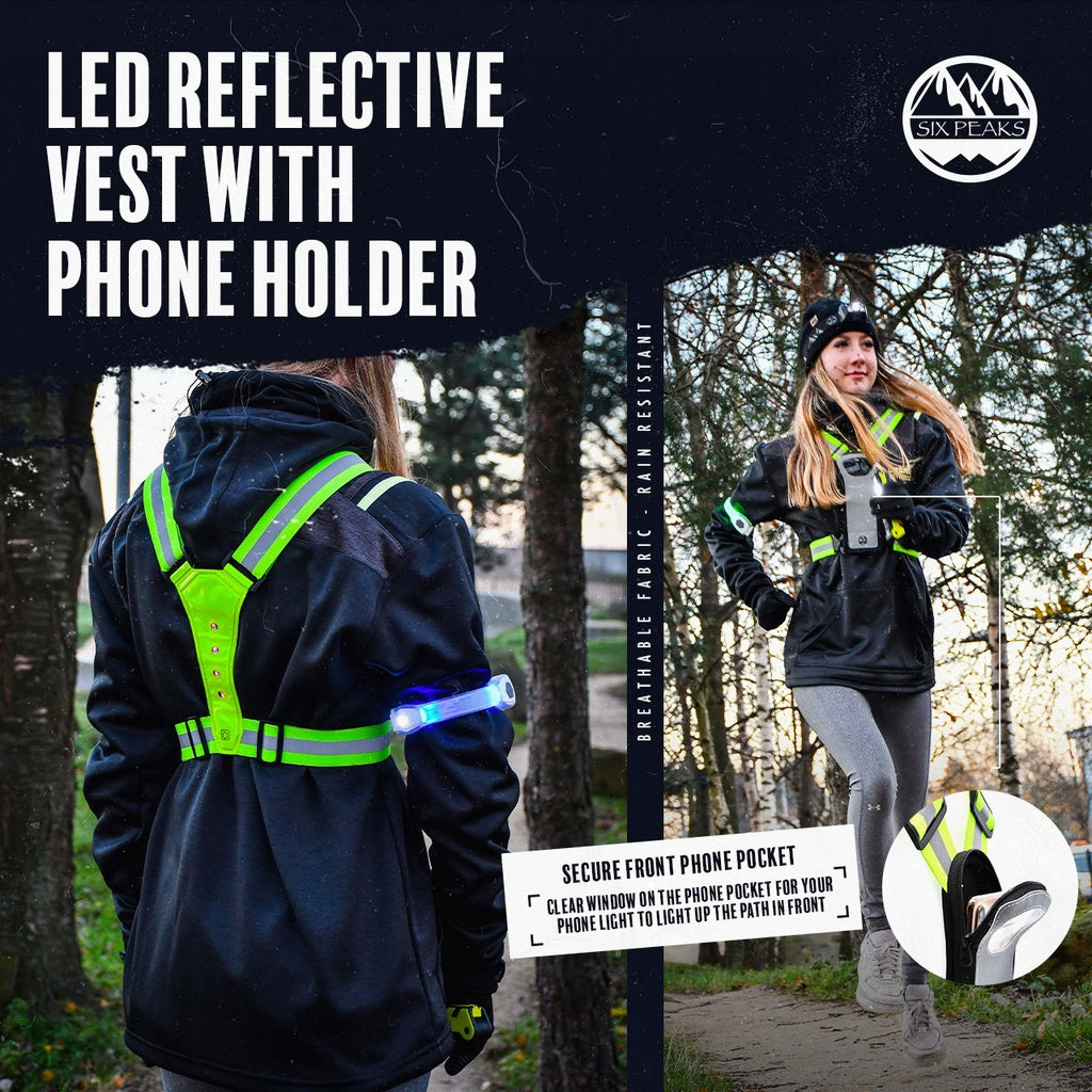 A woman wears the Six Peaks LED Reflective Vest with Phone Holder over a black jacket. This hi-vis vest by Six Peaks offers enhanced safety and a secure, clear window phone holder for easy access during outdoor activities.