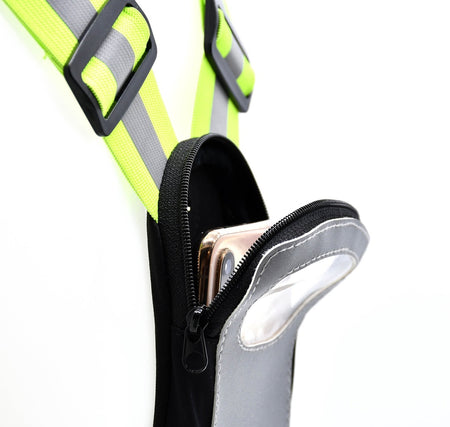 Close-up of the Six Peaks LED Reflective Vest with Phone Holder, featuring fluorescent yellow straps, black buckles, and a gray zippered pouch by Six Peaks attached to the harness, holding a partially visible smartphone.