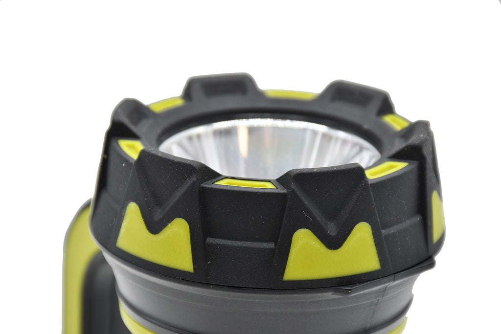 Close-up of the Six Peaks Multi-function Torch Lantern by Six Peaks, highlighting its rugged black and yellow design, textured grip, and reflective lens against a white background.