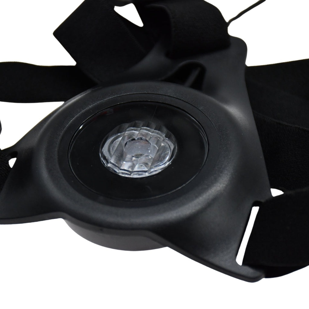 Close-up of the Six Peaks Running LED Chest Lamp by Six Peaks, featuring adjustable black straps and a central transparent circular light—an outdoor safety device designed for runners.