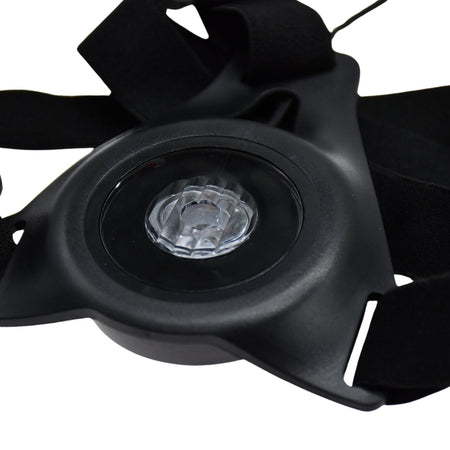 Close-up of the Six Peaks Running LED Chest Lamp by Six Peaks, featuring adjustable black straps and a central transparent circular light—an outdoor safety device designed for runners.