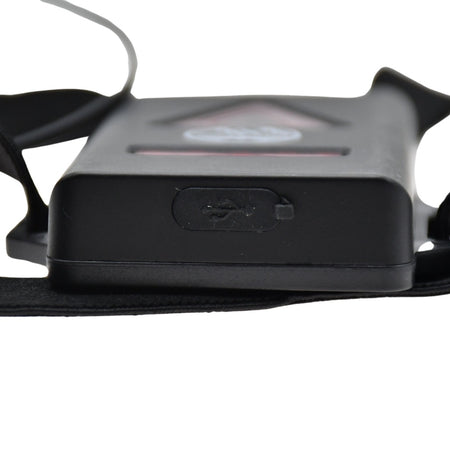 Close-up of the Six Peaks Running LED Chest Lamp by Six Peaks, showing its black design, side USB port, and attached straps. The image highlights the lamp’s side profile and charging port, ideal for runners.