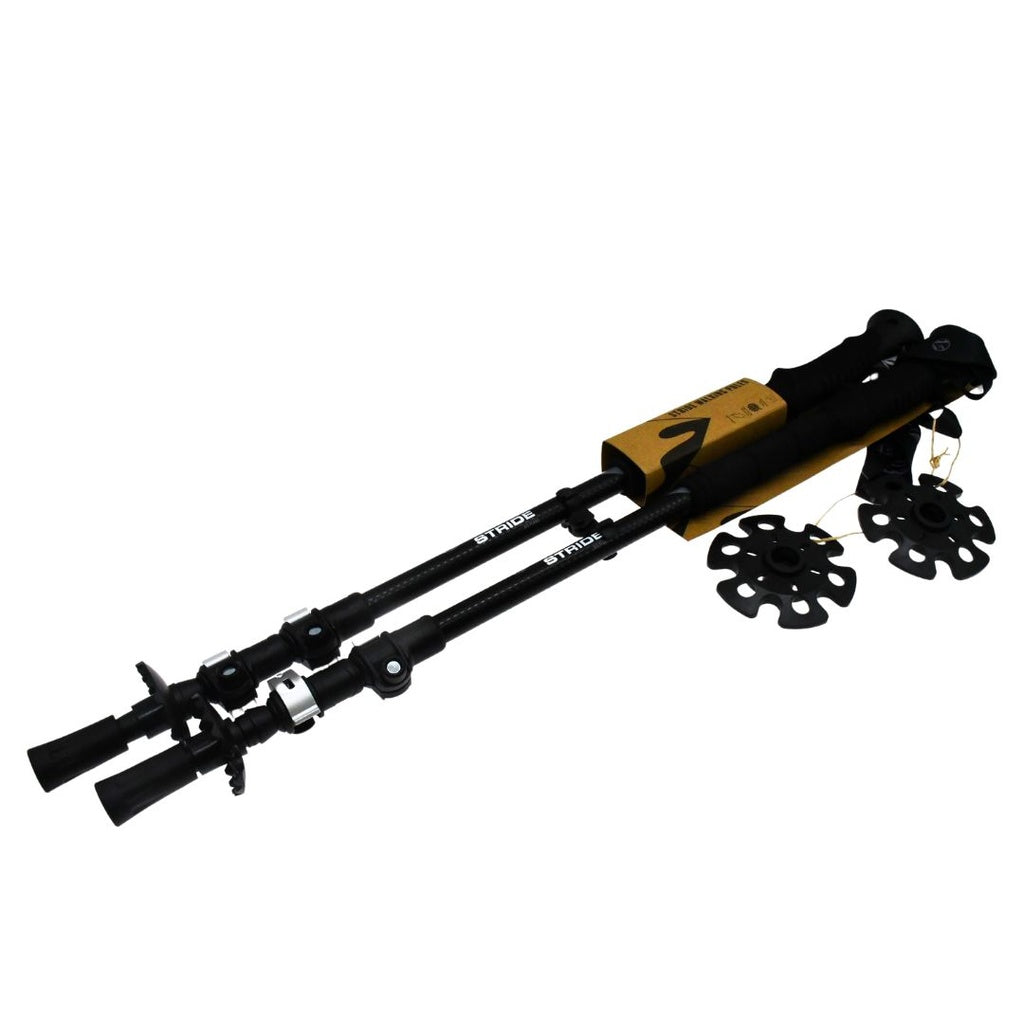 Two black Six Peaks Stride Walking Poles with ergonomic handles, adjustable length, and detachable round baskets are shown side by side. Also pictured: extra baskets and tags—perfect hiking gear from Six Peaks for outdoor enthusiasts.