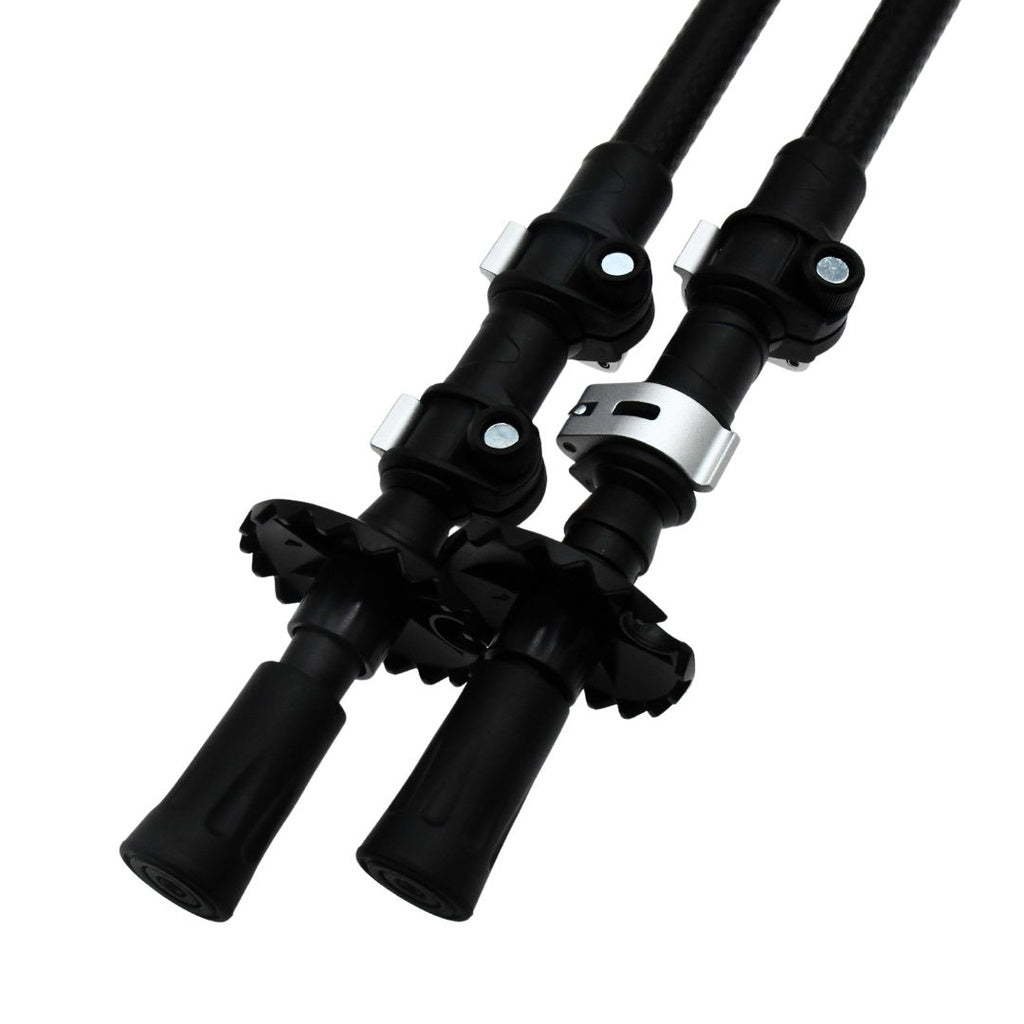 Close-up of two Six Peaks Stride Walking Poles by Six Peaks, black and adjustable with secure locks, rubber grips at the base, and circular baskets above the tips—essential hiking gear shown side by side on a white background.