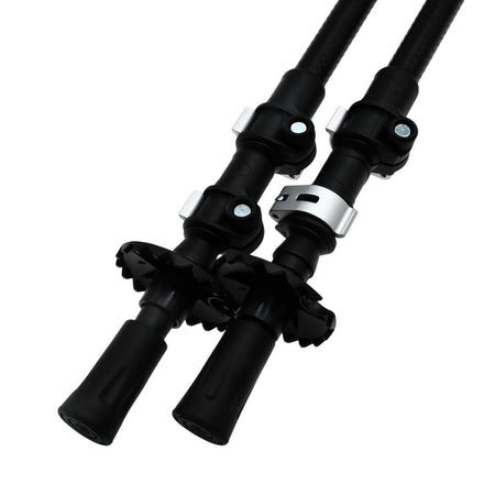 Close-up of two Six Peaks Stride Walking Poles by Six Peaks, black and adjustable with secure locks, rubber grips at the base, and circular baskets above the tips—essential hiking gear shown side by side on a white background.