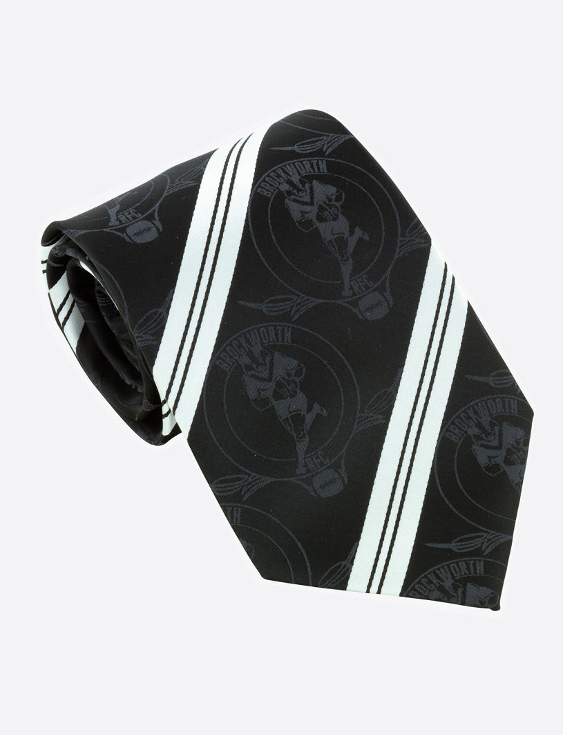The Martin Berrill Sports Custom Club & School Tie features black with white diagonal stripes, a circular logo, and cricket player motif—perfect for a bespoke look. Presented neatly rolled against a plain light background.