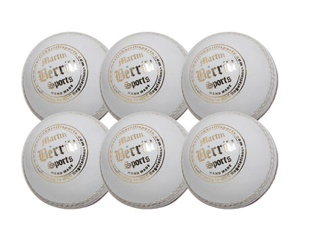 The MBS Supreme Crown Six Pack features six white leather cricket balls with gold and black Martin Berrill Sports branding, arranged in two rows on a plain white background—ideal for training sessions.