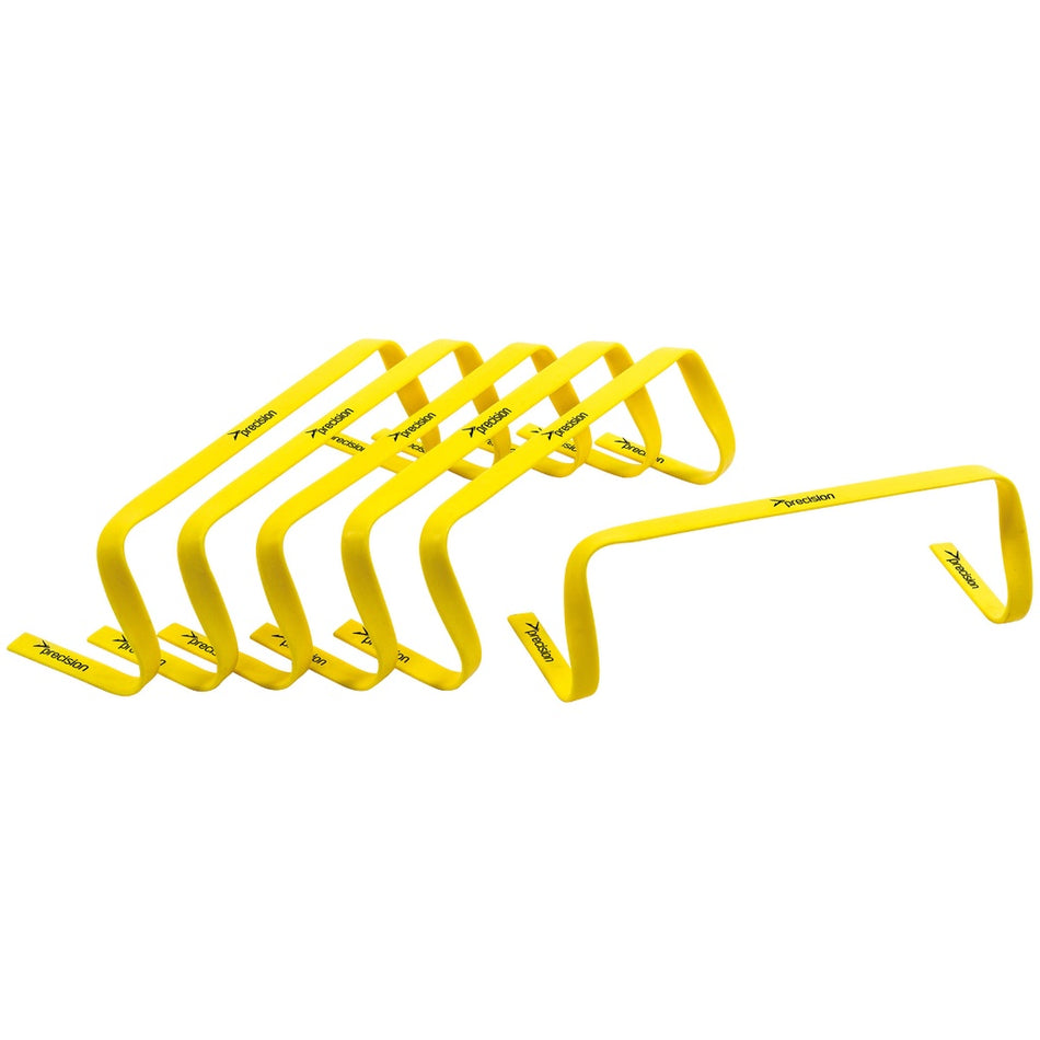 Six lightweight Precision Training Flat Hurdles (Set of 6) are arranged in a staggered line, featuring a bright yellow rectangular bent shape. The "Precision" branding is visible on top, set against a white background.